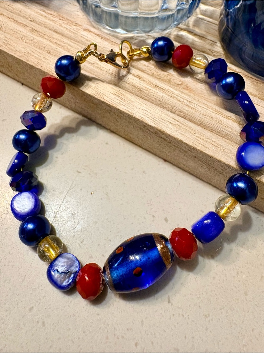 Artisan Jewelry: bracelet in cobalt blue, red and gold